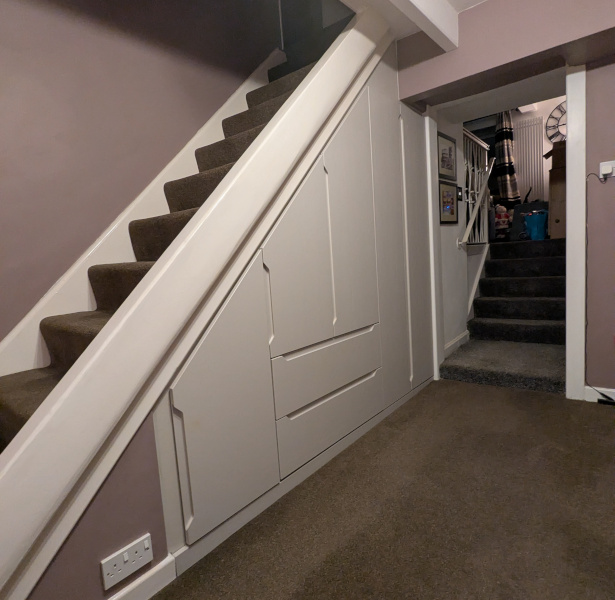 Cashmere Oak fitted understair storage in Mossley